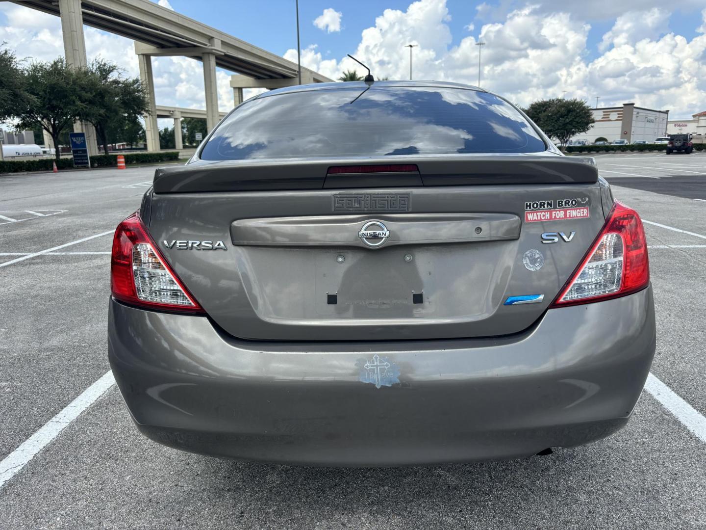 2013 Silver Nissan Versa 1.6 S 5M (3N1CN7AP7DL) with an 1.6L L4 DOHC 16V engine, 5-Speed Manual transmission, located at 5005 Telephone Rd., Houston, TX, 77087, (713) 641-0980, 29.690666, -95.298683 - Photo#3