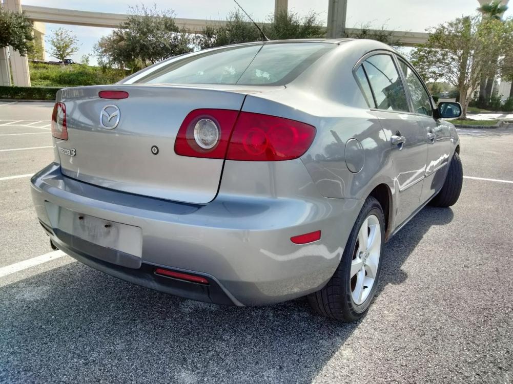 2005 Gray Mazda MAZDA3 i 4-door (JM1BK12F751) with an 2.0L L4 DOHC 16V engine, located at 5005 Telephone Rd., Houston, TX, 77087, (713) 641-0980, 29.690666, -95.298683 - Photo #3