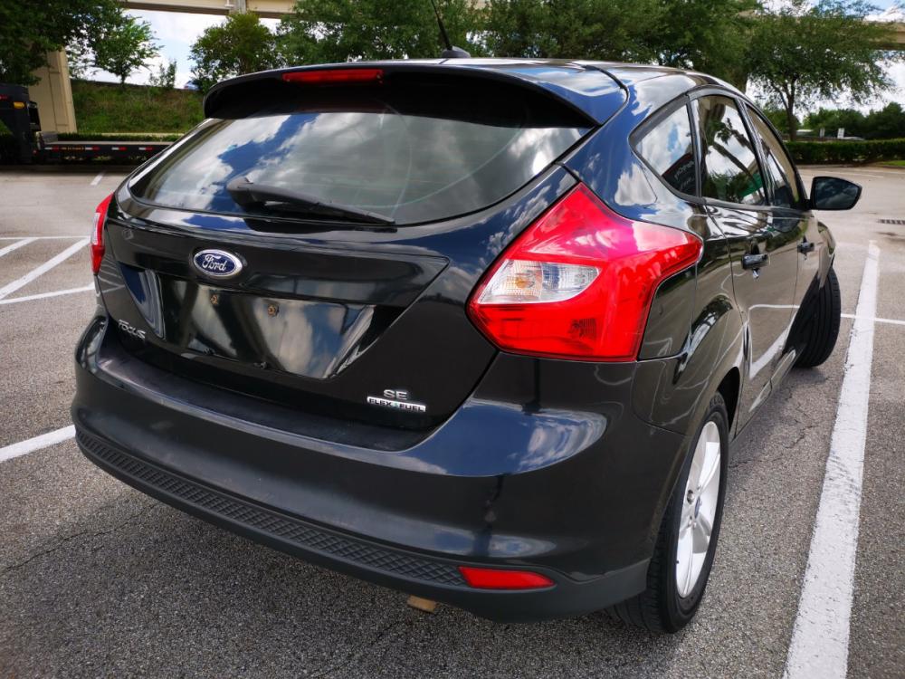 2014 black Ford Focus SE Hatch (1FADP3K28EL) with an 2.0L L4 DOHC 16V engine, located at 5005 Telephone Rd., Houston, TX, 77087, (713) 641-0980, 29.690666, -95.298683 - Photo #4