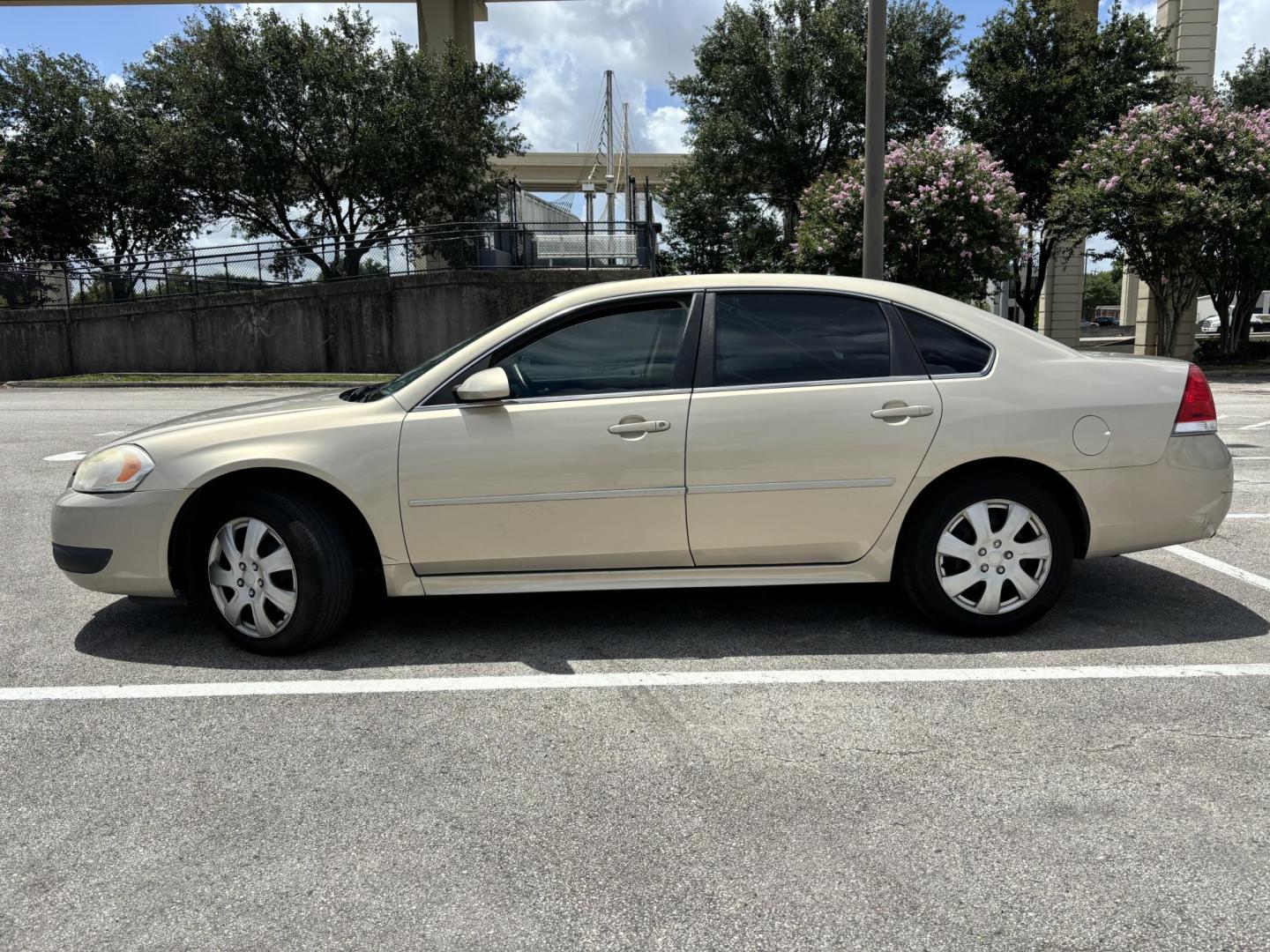 2012 Tan Chevrolet Impala Police Cruiser (2G1WD5E30C1) with an 3.6L V6 DOHC 16V FFV engine, 6-Speed Automatic transmission, located at 5005 Telephone Rd., Houston, TX, 77087, (713) 641-0980, 29.690666, -95.298683 - Photo#2