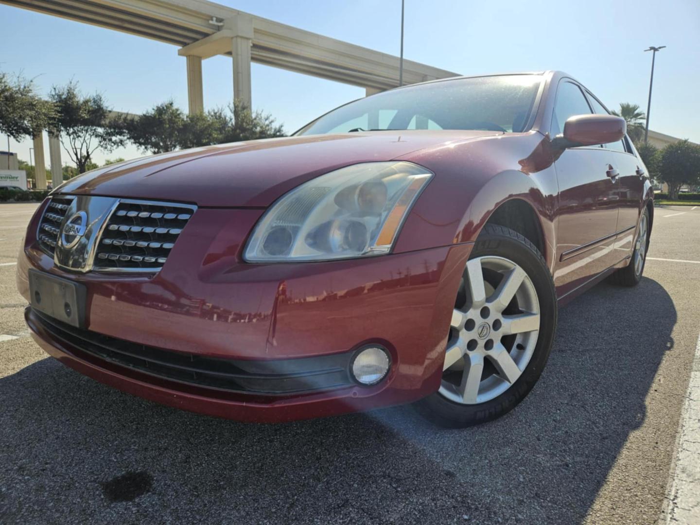 2005 Red Nissan Maxima SE (1N4BA41EX5C) with an 3.5L V6 DOHC 24V engine, 5-Speed Automatic Overdrive transmission, located at 5005 Telephone Rd., Houston, TX, 77087, (713) 641-0980, 29.690666, -95.298683 - Photo#0