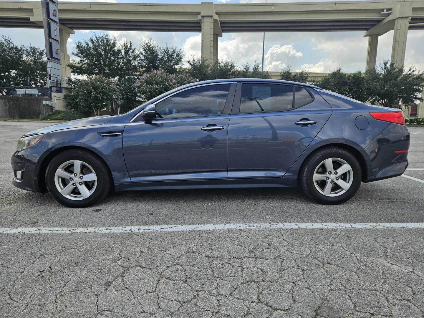 2015 Blue Kia Optima LX (5XXGM4A7XFG) with an 2.4L L4 DOHC 16V engine, 6-Speed Automatic transmission, located at 5005 Telephone Rd., Houston, TX, 77087, (713) 641-0980, 29.690666, -95.298683 - Photo#2