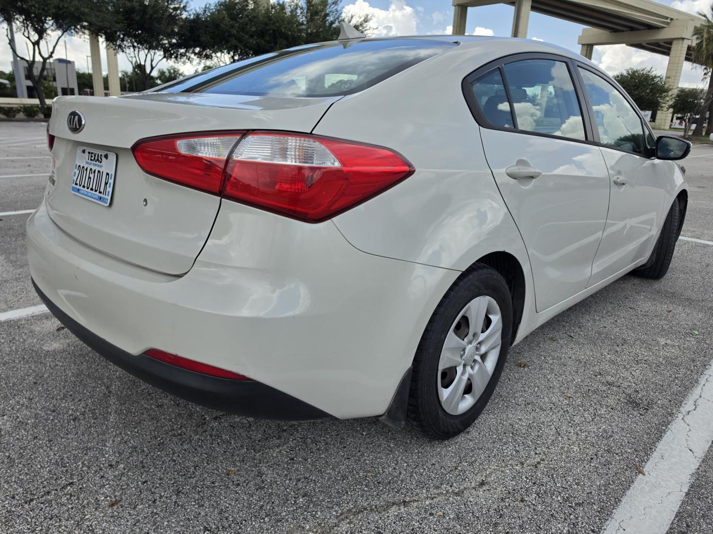 2015 white Kia Forte LX (KNAFK4A61F5) with an 1.8L L4 DOHC 16V engine, located at 5005 Telephone Rd., Houston, TX, 77087, (713) 641-0980, 29.690666, -95.298683- Photo#2