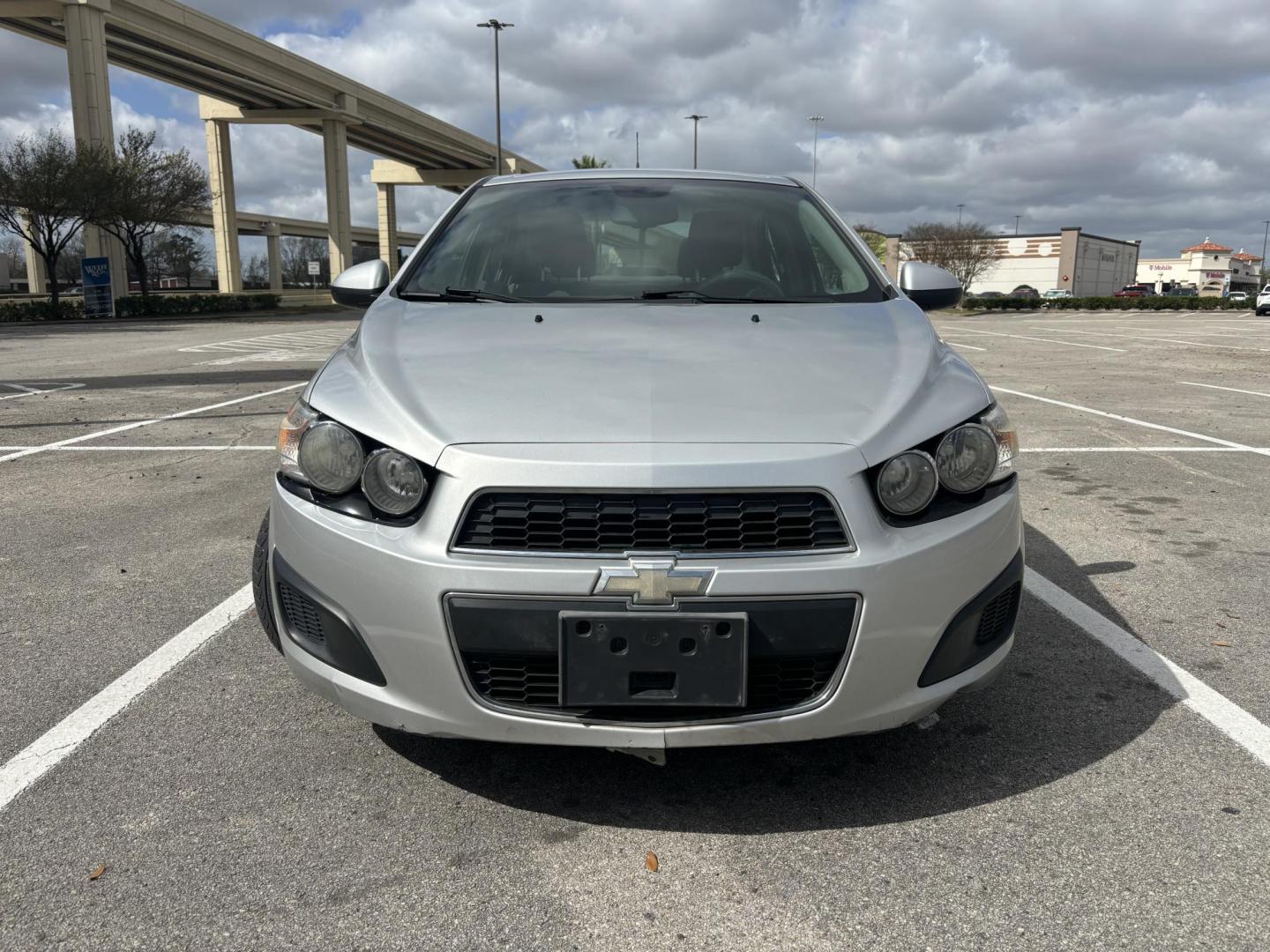 2012 silver Chevrolet Sonic 2LS Sedan (1G1JA5SH1C4) with an 1.8L L4 DOHC 24V FFV engine, 6-Speed Automatic transmission, located at 5005 Telephone Rd., Houston, TX, 77087, (713) 641-0980, 29.690666, -95.298683 - Photo#1