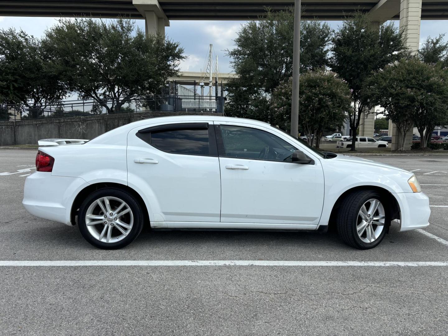 2013 white Dodge Avenger SE (1C3CDZAGXDN) with an 3.6L V6 DOHC 24V FFV engine, 6-Speed Automatic transmission, located at 5005 Telephone Rd., Houston, TX, 77087, (713) 641-0980, 29.690666, -95.298683 - Photo#5