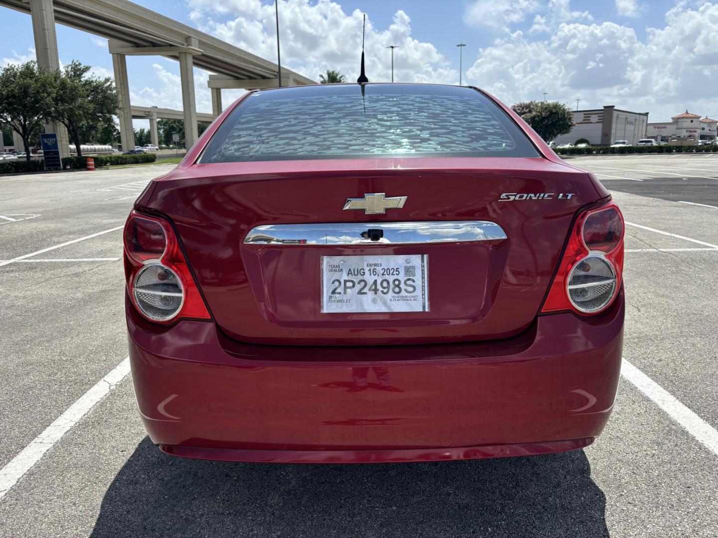 2014 Red Chevrolet Sonic LT Auto Sedan (1G1JC5SH5E4) with an 1.8L L4 DOHC 24V engine, 6-Speed Automatic transmission, located at 5005 Telephone Rd., Houston, TX, 77087, (713) 641-0980, 29.690666, -95.298683 - Photo#3