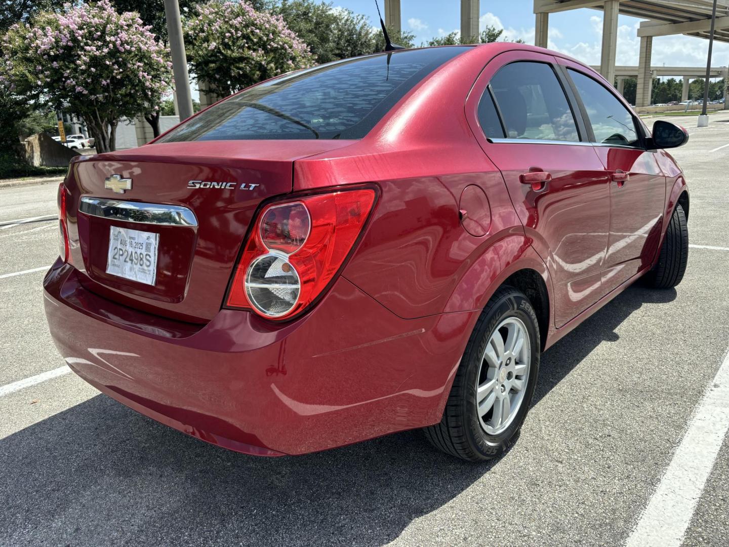 2014 Red Chevrolet Sonic LT Auto Sedan (1G1JC5SH5E4) with an 1.8L L4 DOHC 24V engine, 6-Speed Automatic transmission, located at 5005 Telephone Rd., Houston, TX, 77087, (713) 641-0980, 29.690666, -95.298683 - Photo#4