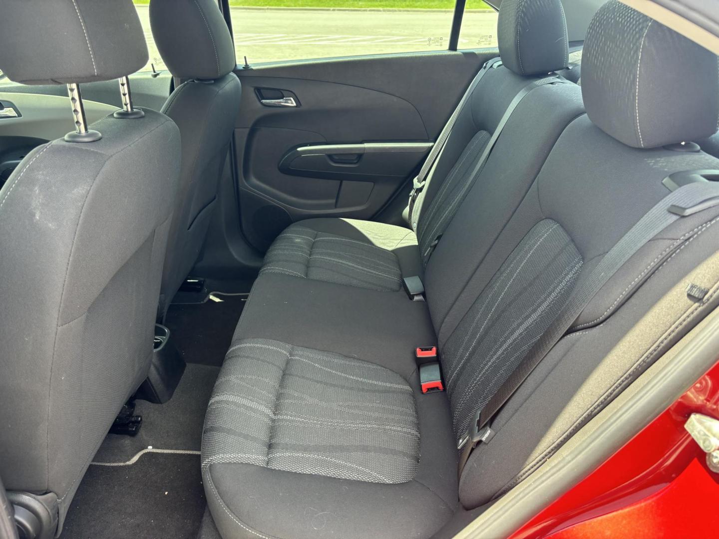 2014 Red Chevrolet Sonic LT Auto Sedan (1G1JC5SH5E4) with an 1.8L L4 DOHC 24V engine, 6-Speed Automatic transmission, located at 5005 Telephone Rd., Houston, TX, 77087, (713) 641-0980, 29.690666, -95.298683 - Photo#6
