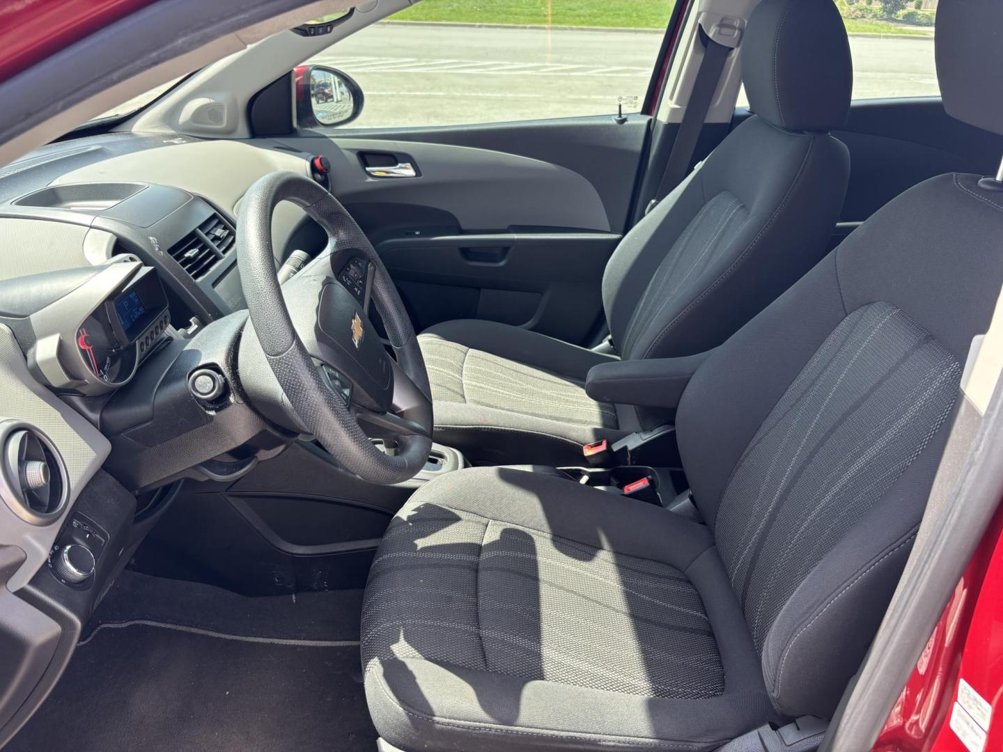 2014 Red Chevrolet Sonic LT Auto Sedan (1G1JC5SH5E4) with an 1.8L L4 DOHC 24V engine, 6-Speed Automatic transmission, located at 5005 Telephone Rd., Houston, TX, 77087, (713) 641-0980, 29.690666, -95.298683 - Photo#7
