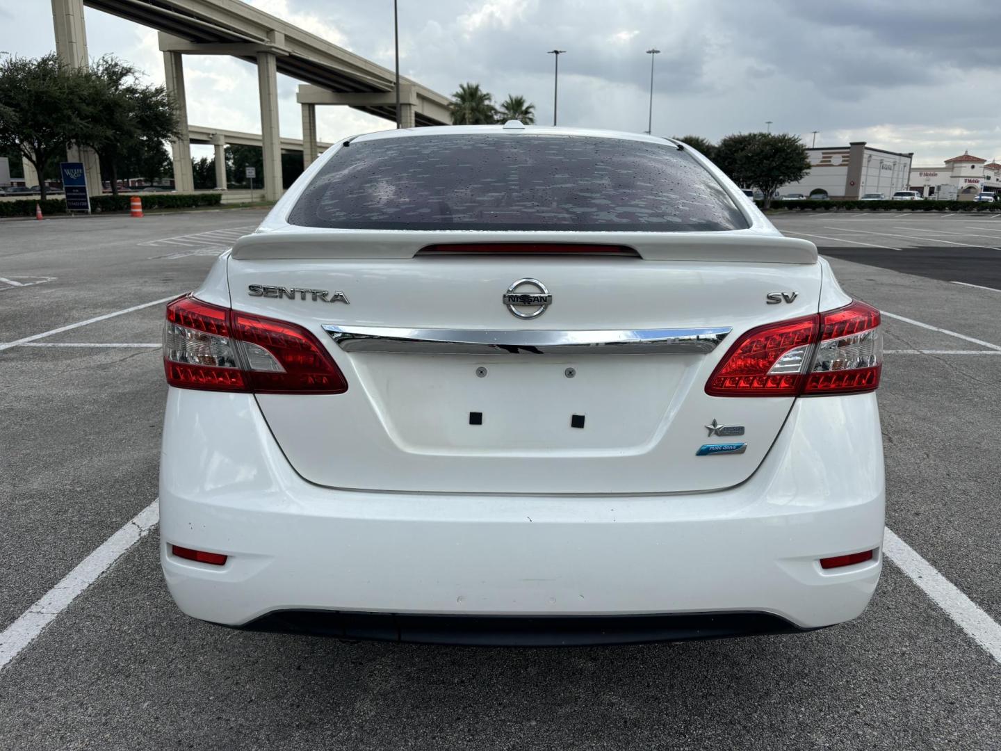2013 White Nissan Sentra S 6MT (3N1AB7AP8DL) with an 2.0L L4 DOHC 16V engine, 6-Speed Manual transmission, located at 5005 Telephone Rd., Houston, TX, 77087, (713) 641-0980, 29.690666, -95.298683 - Photo#3