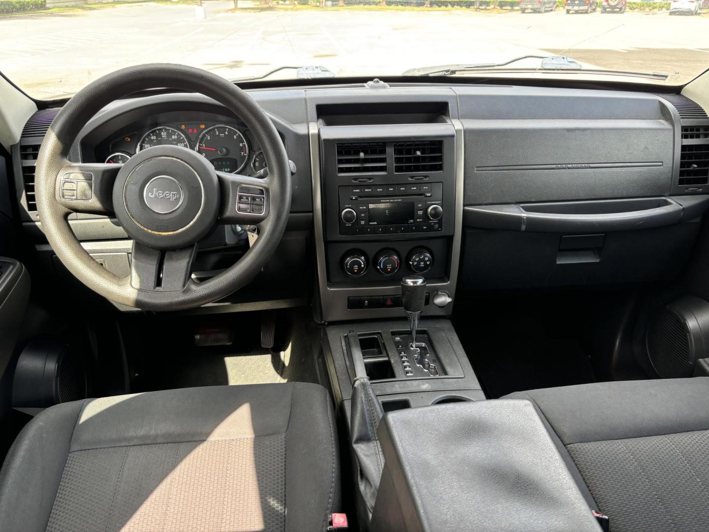 2012 Black Jeep Liberty Sport 2WD (1C4PJLAK2CW) with an 3.7L V6 SOHC 12V engine, 4-Speed Automatic transmission, located at 5005 Telephone Rd., Houston, TX, 77087, (713) 641-0980, 29.690666, -95.298683 - Photo#8