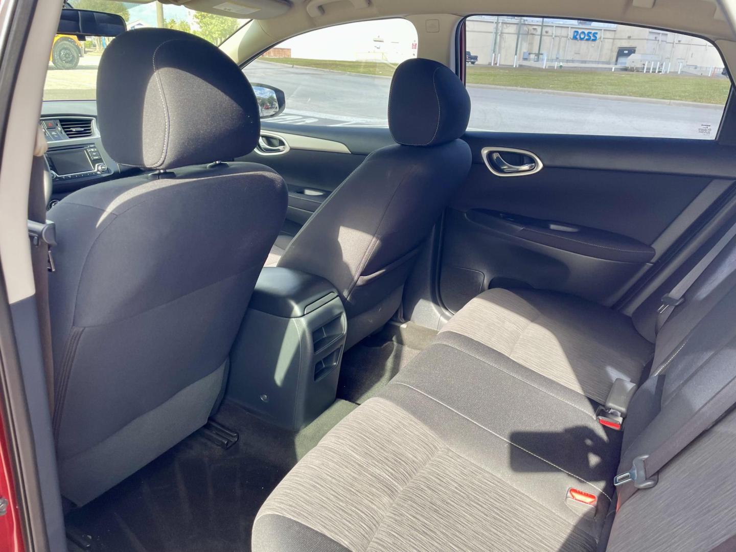 2015 Red Nissan Sentra S 6MT (3N1AB7AP8FL) with an 1.8L L4 SFI DOHC 16V engine, 6-Speed Manual transmission, located at 5005 Telephone Rd., Houston, TX, 77087, (713) 641-0980, 29.690666, -95.298683 - Photo#4