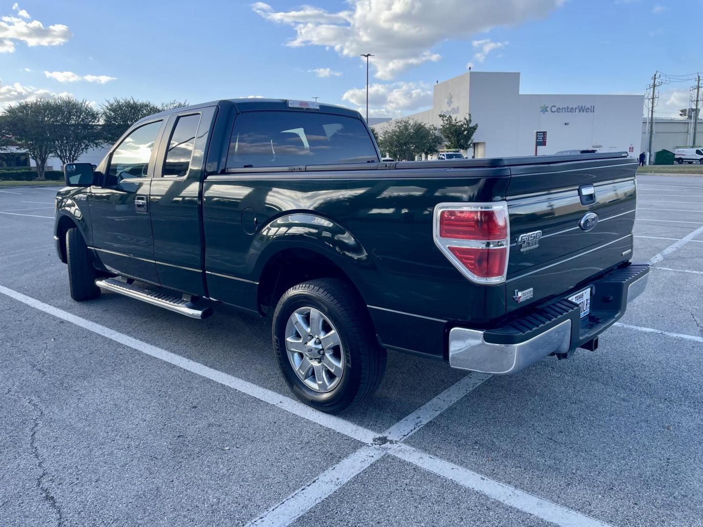 2013 Green Ford F-150 XLT SuperCab 8-ft. Bed 2WD (1FTEX1CM8DK) with an 3.7L V6 DOHC 24V engine, 6-Speed Automatic transmission, located at 5005 Telephone Rd., Houston, TX, 77087, (713) 641-0980, 29.690666, -95.298683 - Photo#1