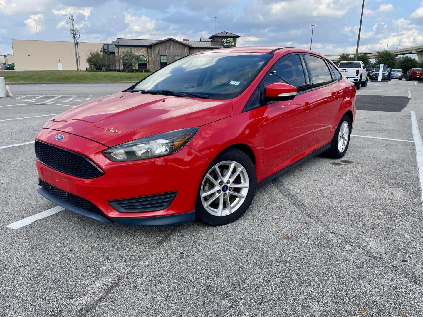 2017 Red Ford Focus SE Sedan (1FADP3F22HL) with an 2.0L L4 DOHC 16V engine, located at 5005 Telephone Rd., Houston, TX, 77087, (713) 641-0980, 29.690666, -95.298683 - Photo#0