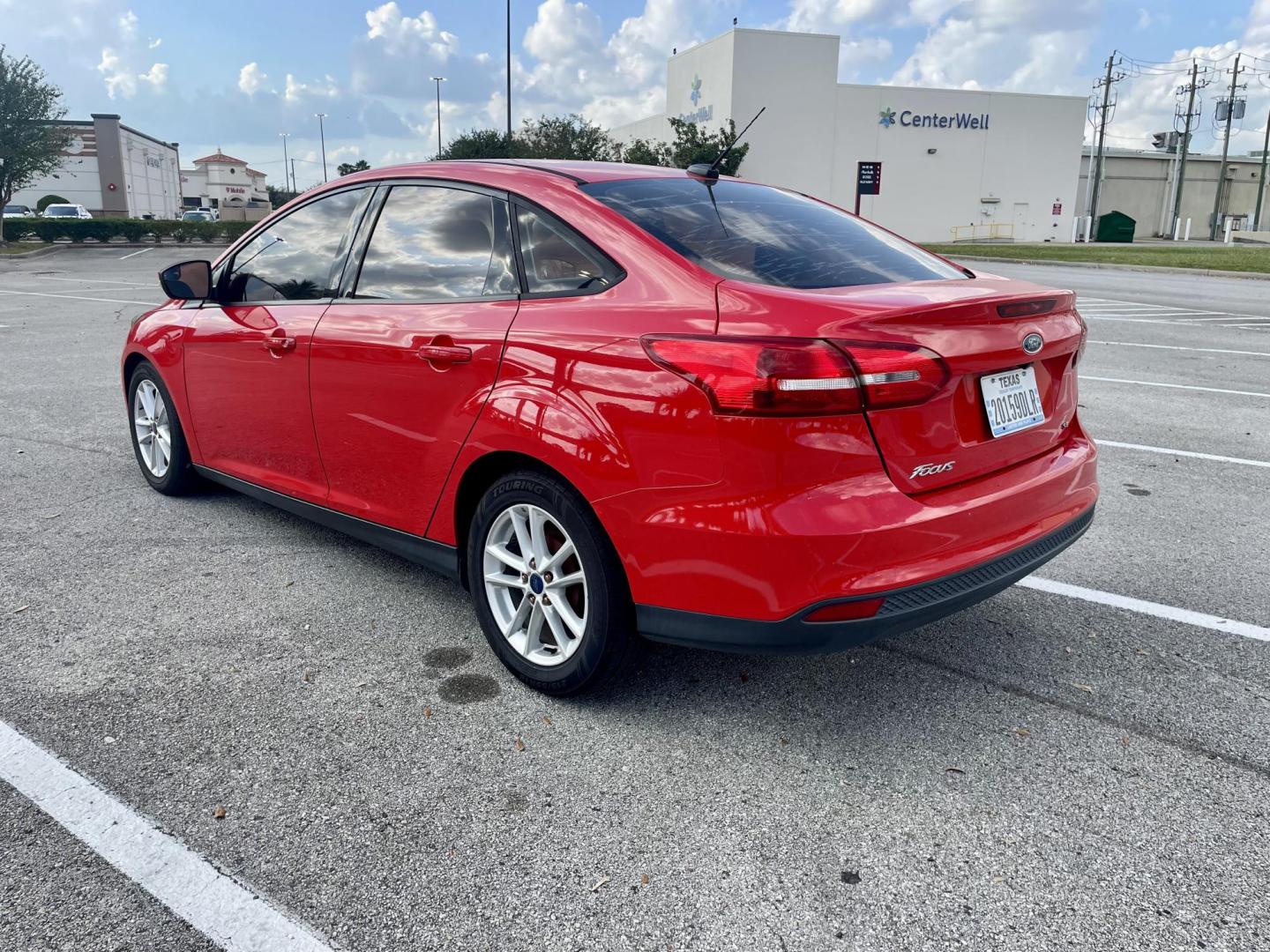 2017 Red Ford Focus SE Sedan (1FADP3F22HL) with an 2.0L L4 DOHC 16V engine, located at 5005 Telephone Rd., Houston, TX, 77087, (713) 641-0980, 29.690666, -95.298683 - Photo#1