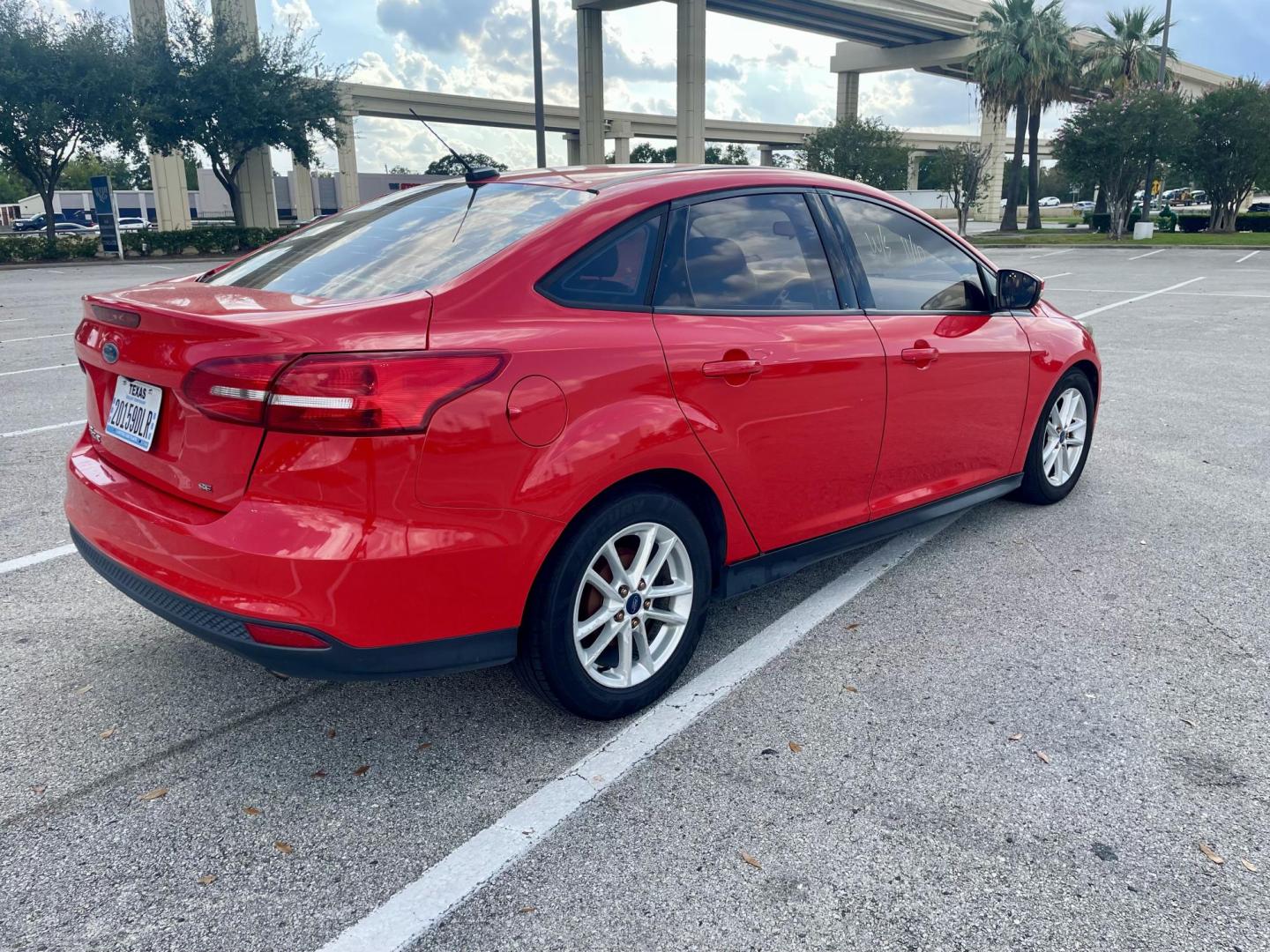 2017 Red Ford Focus SE Sedan (1FADP3F22HL) with an 2.0L L4 DOHC 16V engine, located at 5005 Telephone Rd., Houston, TX, 77087, (713) 641-0980, 29.690666, -95.298683 - Photo#3