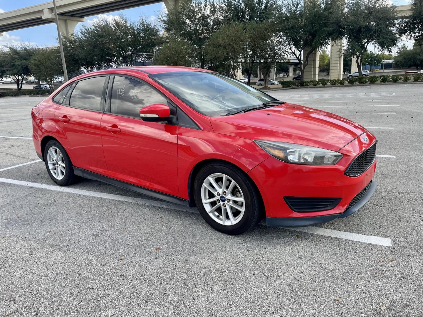 2017 Red Ford Focus SE Sedan (1FADP3F22HL) with an 2.0L L4 DOHC 16V engine, located at 5005 Telephone Rd., Houston, TX, 77087, (713) 641-0980, 29.690666, -95.298683 - Photo#2