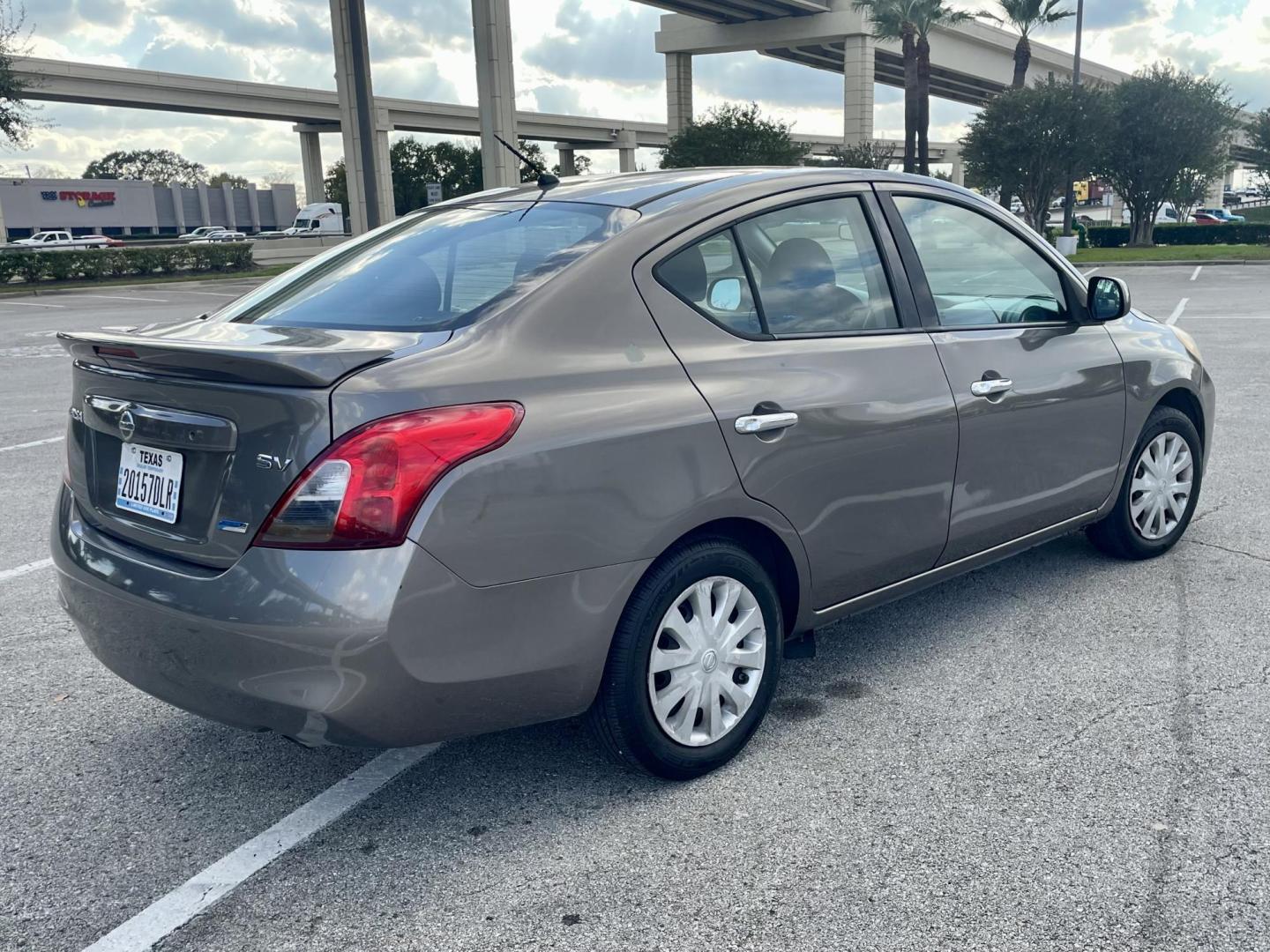 2014 Gray Nissan Versa 1.6 S 5M (3N1CN7AP3EL) with an 1.6L L4 DOHC 16V engine, 5-Speed Manual transmission, located at 5005 Telephone Rd., Houston, TX, 77087, (713) 641-0980, 29.690666, -95.298683 - Photo#2