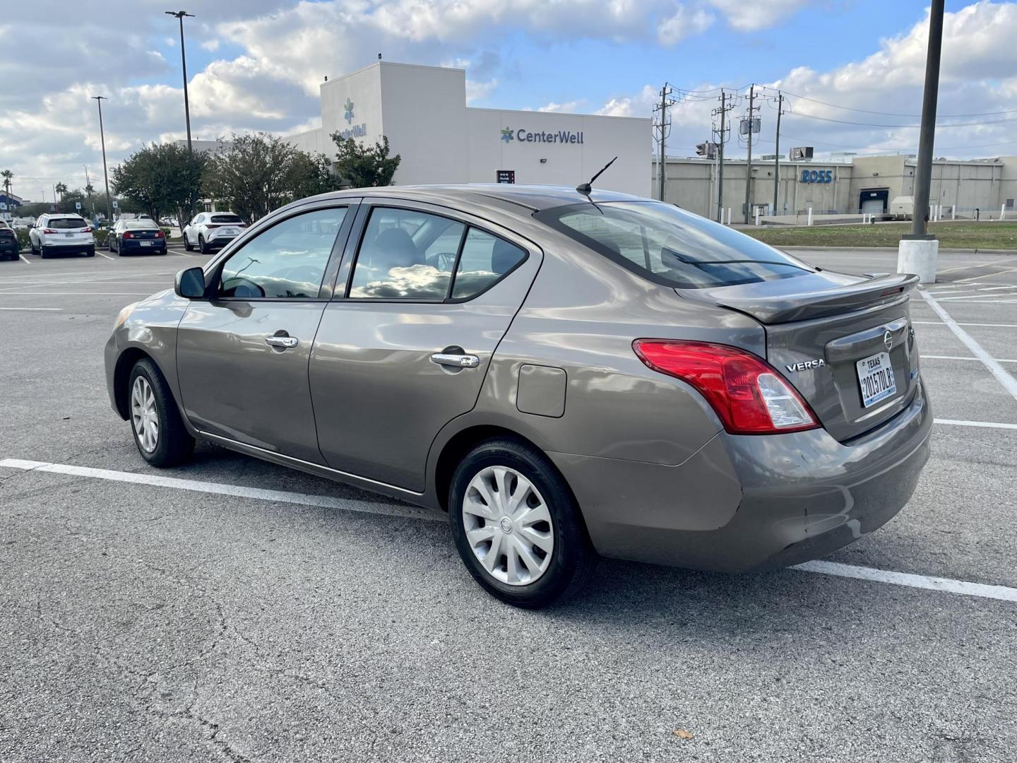 2014 Gray Nissan Versa 1.6 S 5M (3N1CN7AP3EL) with an 1.6L L4 DOHC 16V engine, 5-Speed Manual transmission, located at 5005 Telephone Rd., Houston, TX, 77087, (713) 641-0980, 29.690666, -95.298683 - Photo#1