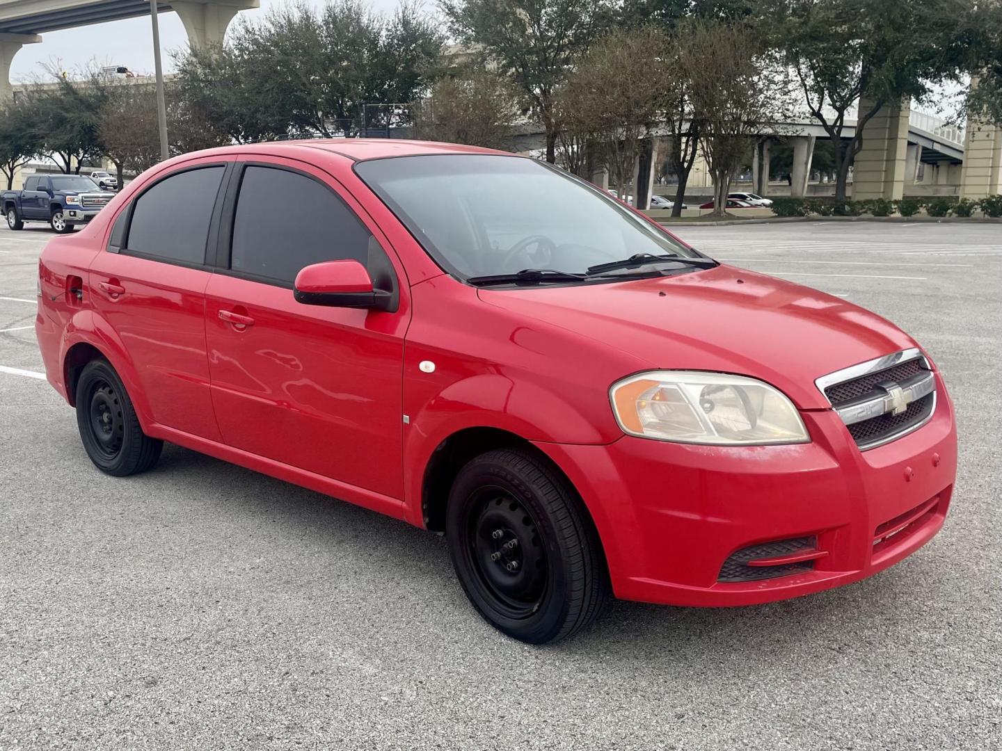 2007 Red Chevrolet Aveo LS 4-Door (KL1TD56657B) with an 2.2L L4 DOHC 16V engine, located at 5005 Telephone Rd., Houston, TX, 77087, (713) 641-0980, 29.690666, -95.298683 - Photo#3
