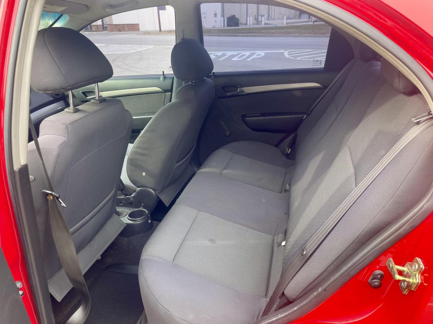 2007 Red Chevrolet Aveo LS 4-Door (KL1TD56657B) with an 2.2L L4 DOHC 16V engine, located at 5005 Telephone Rd., Houston, TX, 77087, (713) 641-0980, 29.690666, -95.298683 - Photo#5