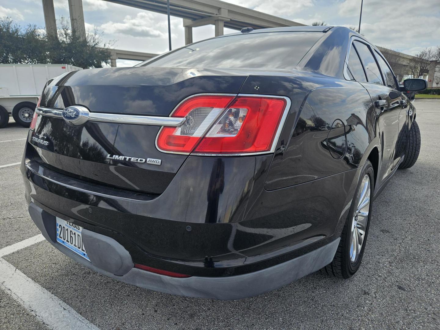 2012 Black Ford Taurus Limited AWD (1FAHP2JW1CG) with an 3.5L V6 DOHC 24V engine, 6-Speed Automatic transmission, located at 5005 Telephone Rd., Houston, TX, 77087, (713) 641-0980, 29.690666, -95.298683 - Photo#3