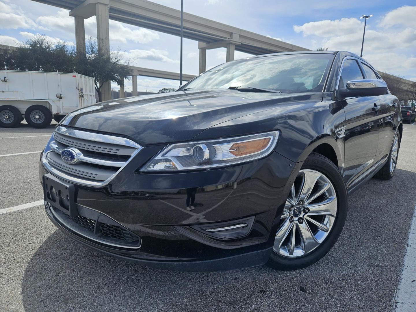 2012 Black Ford Taurus Limited AWD (1FAHP2JW1CG) with an 3.5L V6 DOHC 24V engine, 6-Speed Automatic transmission, located at 5005 Telephone Rd., Houston, TX, 77087, (713) 641-0980, 29.690666, -95.298683 - Photo#0