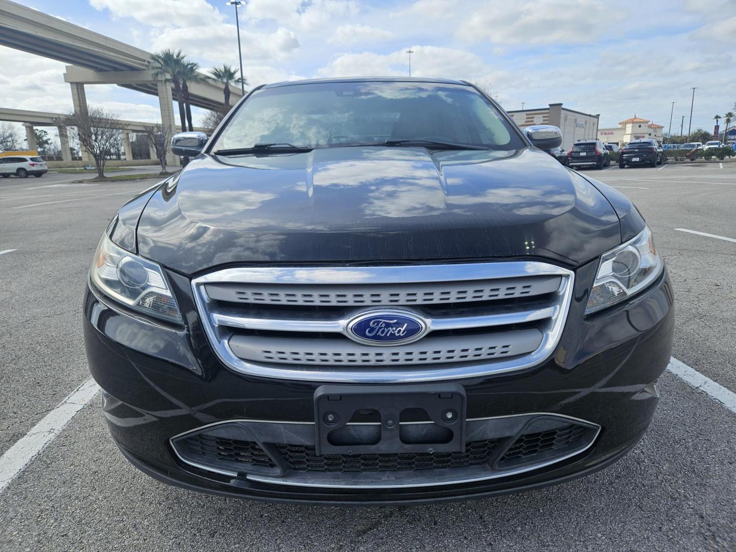 2012 Black Ford Taurus Limited AWD (1FAHP2JW1CG) with an 3.5L V6 DOHC 24V engine, 6-Speed Automatic transmission, located at 5005 Telephone Rd., Houston, TX, 77087, (713) 641-0980, 29.690666, -95.298683 - Photo#1