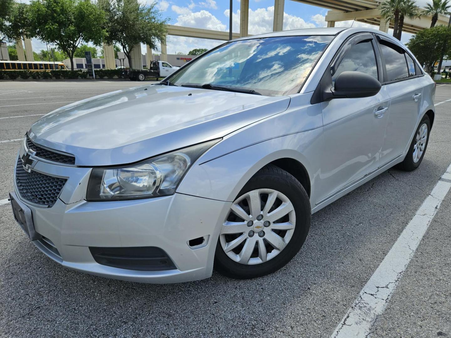 2013 silver Chevrolet Cruze LS Auto (1G1PA5SH3D7) with an 1.8L L4 DOHC 16V FFV engine, 6-Speed Automatic transmission, located at 5005 Telephone Rd., Houston, TX, 77087, (713) 641-0980, 29.690666, -95.298683 - Photo#0