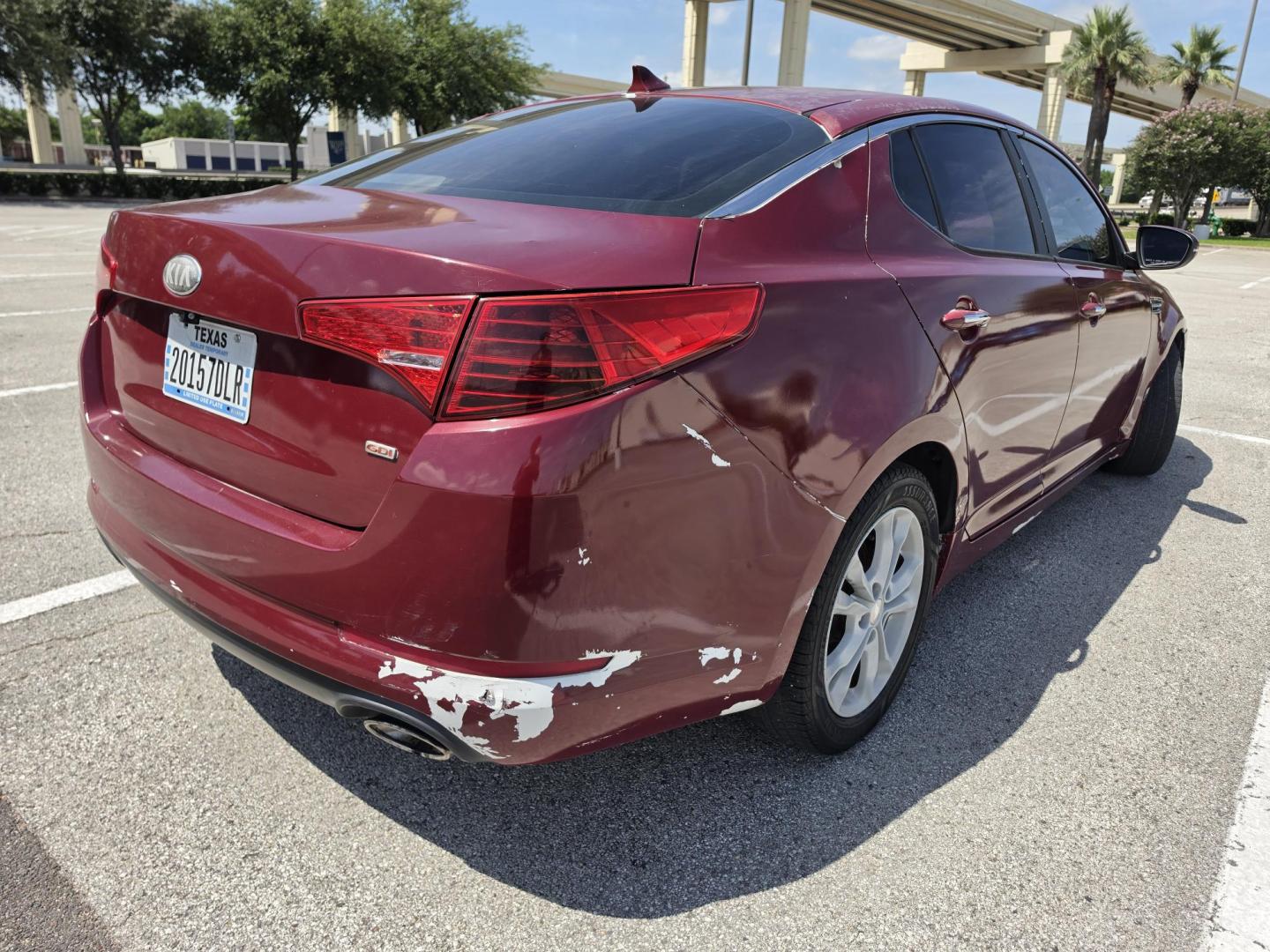 2013 Red Kia Optima LX MT (5XXGM4A79DG) with an 2.4L L4 DOHC 16V engine, 5-Speed Manual transmission, located at 5005 Telephone Rd., Houston, TX, 77087, (713) 641-0980, 29.690666, -95.298683- Photo#1