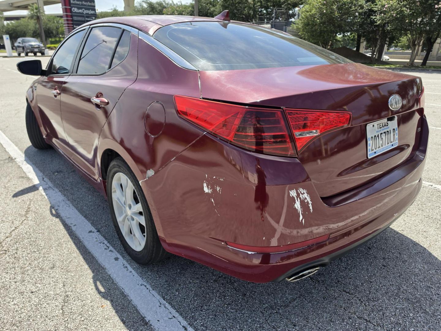 2013 Red Kia Optima LX MT (5XXGM4A79DG) with an 2.4L L4 DOHC 16V engine, 5-Speed Manual transmission, located at 5005 Telephone Rd., Houston, TX, 77087, (713) 641-0980, 29.690666, -95.298683- Photo#3