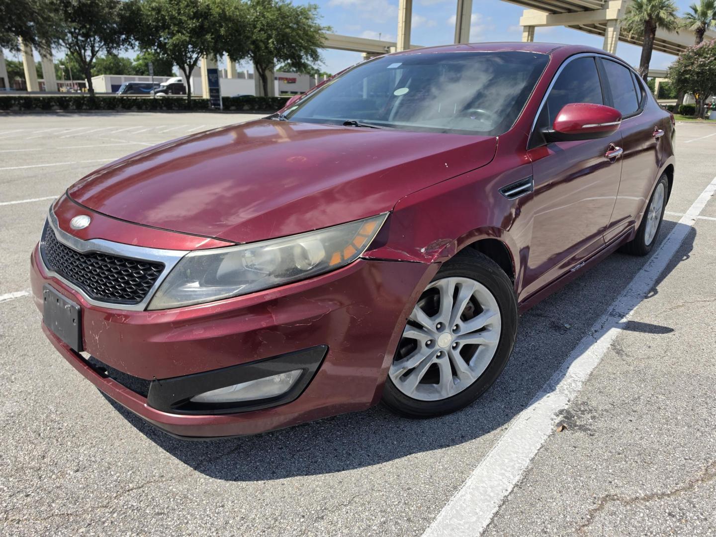 2013 Red Kia Optima LX MT (5XXGM4A79DG) with an 2.4L L4 DOHC 16V engine, 5-Speed Manual transmission, located at 5005 Telephone Rd., Houston, TX, 77087, (713) 641-0980, 29.690666, -95.298683- Photo#0
