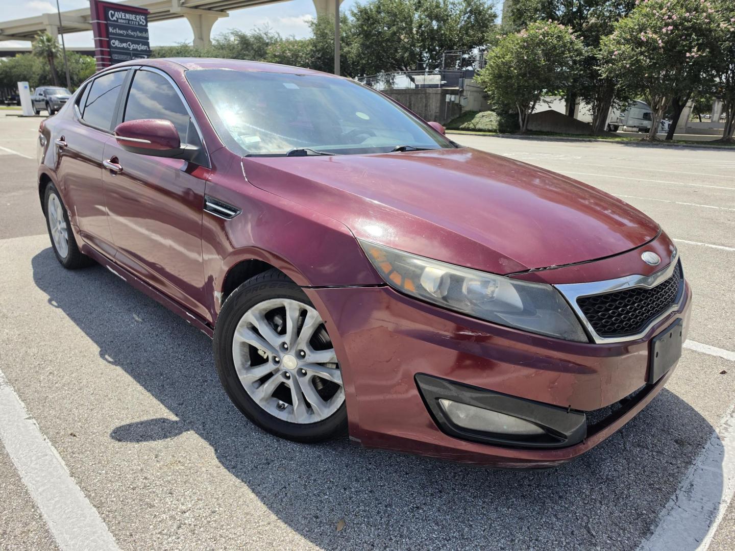 2013 Red Kia Optima LX MT (5XXGM4A79DG) with an 2.4L L4 DOHC 16V engine, 5-Speed Manual transmission, located at 5005 Telephone Rd., Houston, TX, 77087, (713) 641-0980, 29.690666, -95.298683- Photo#2