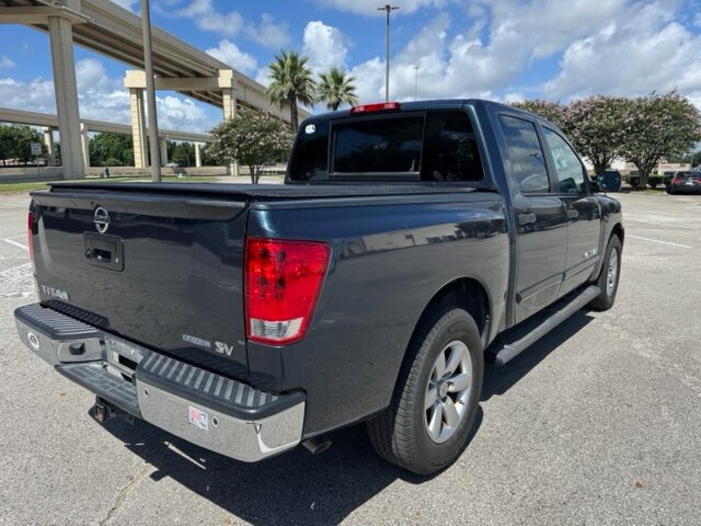 2014 Blue Nissan Titan SV Crew Cab 2WD (1N6BA0ED6EN) with an 5.6L V8 DOHC 32V FFV engine, 5-Speed Automatic transmission, located at 5005 Telephone Rd., Houston, TX, 77087, (713) 641-0980, 29.690666, -95.298683- Photo#3
