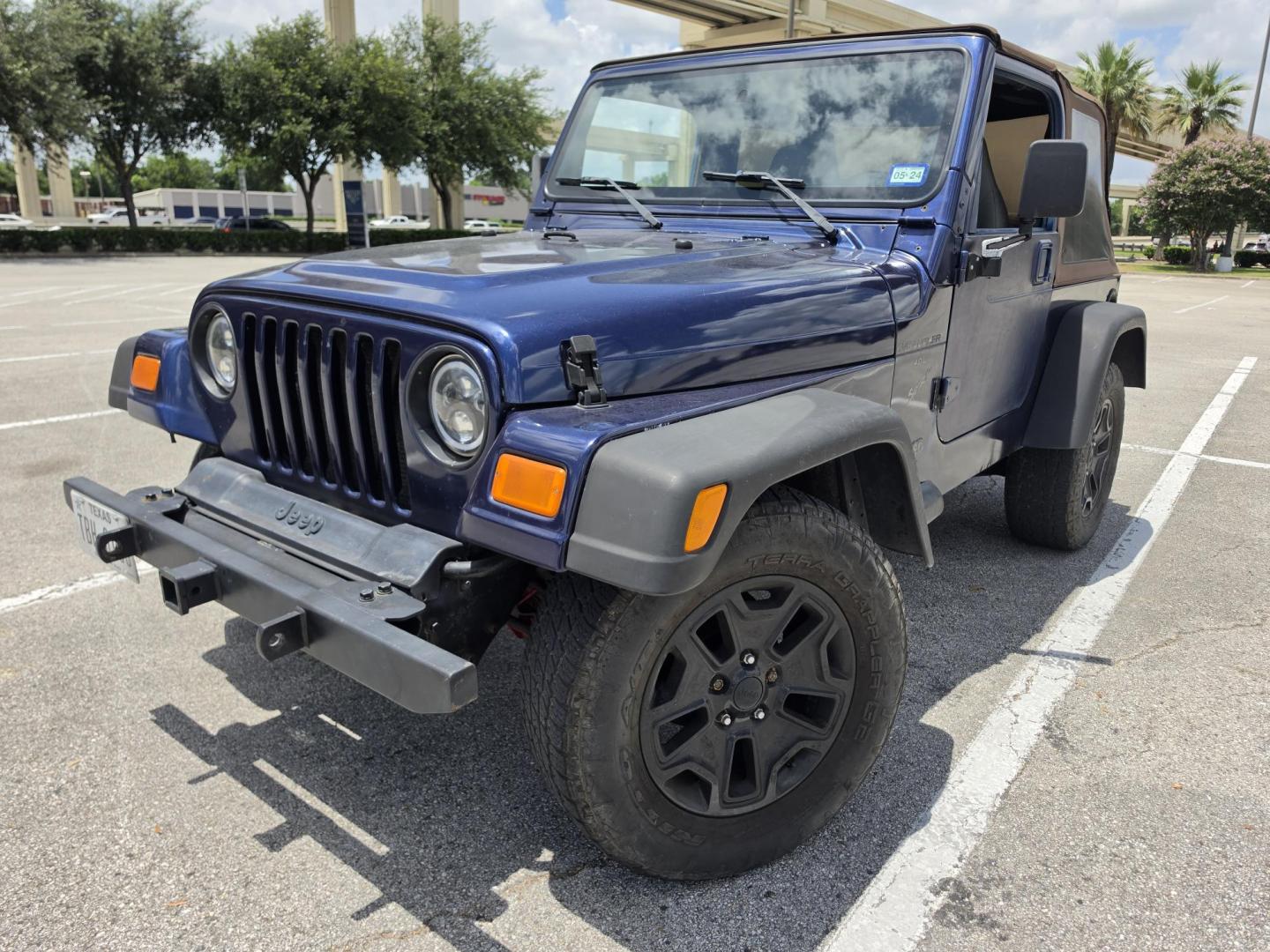 2001 Blue Jeep Wrangler Sport (1J4FA49S31P) with an 4.0L L6 OHV 12V engine, located at 5005 Telephone Rd., Houston, TX, 77087, (713) 641-0980, 29.690666, -95.298683- Photo#0