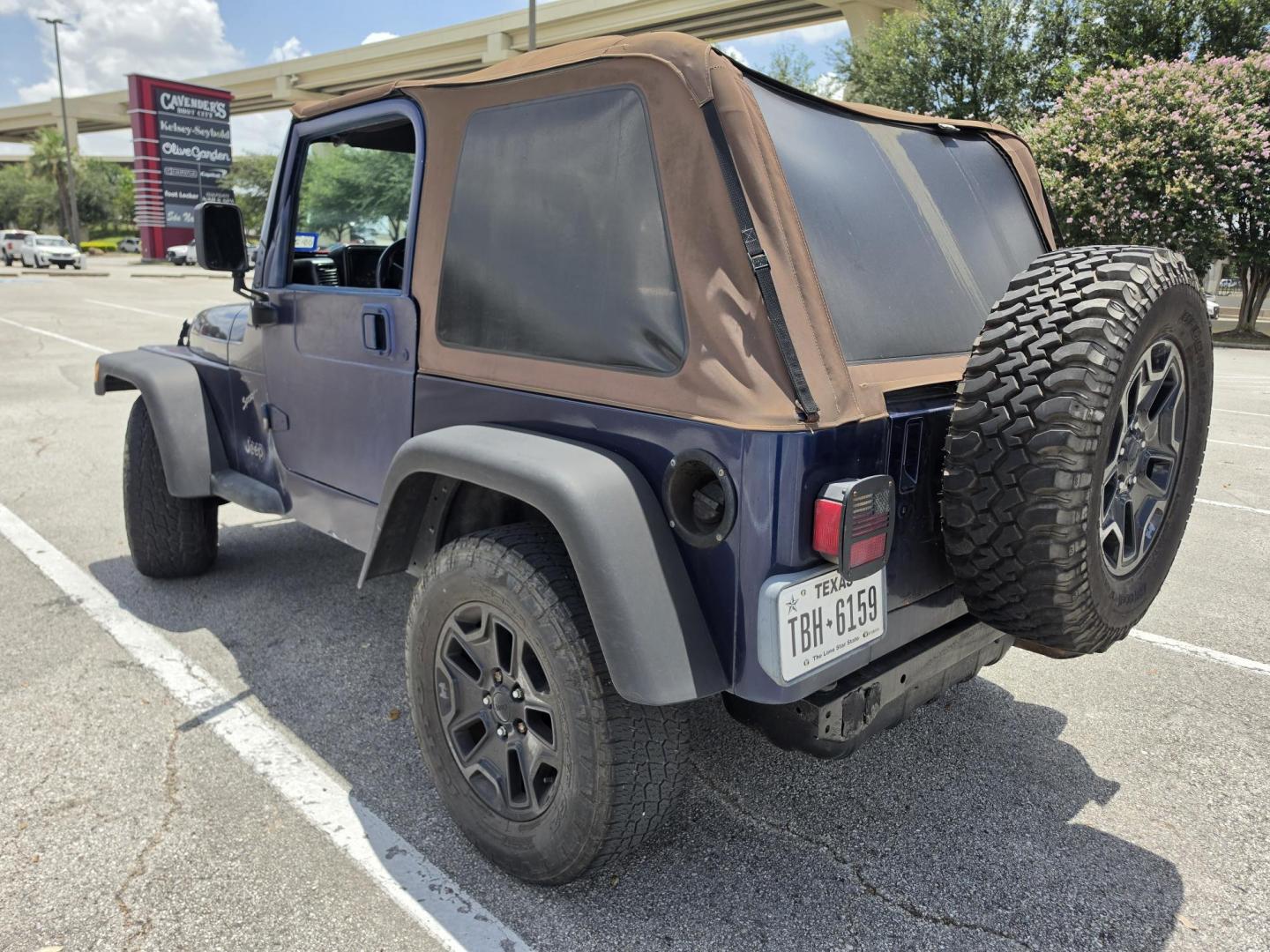 2001 Blue Jeep Wrangler Sport (1J4FA49S31P) with an 4.0L L6 OHV 12V engine, located at 5005 Telephone Rd., Houston, TX, 77087, (713) 641-0980, 29.690666, -95.298683- Photo#1