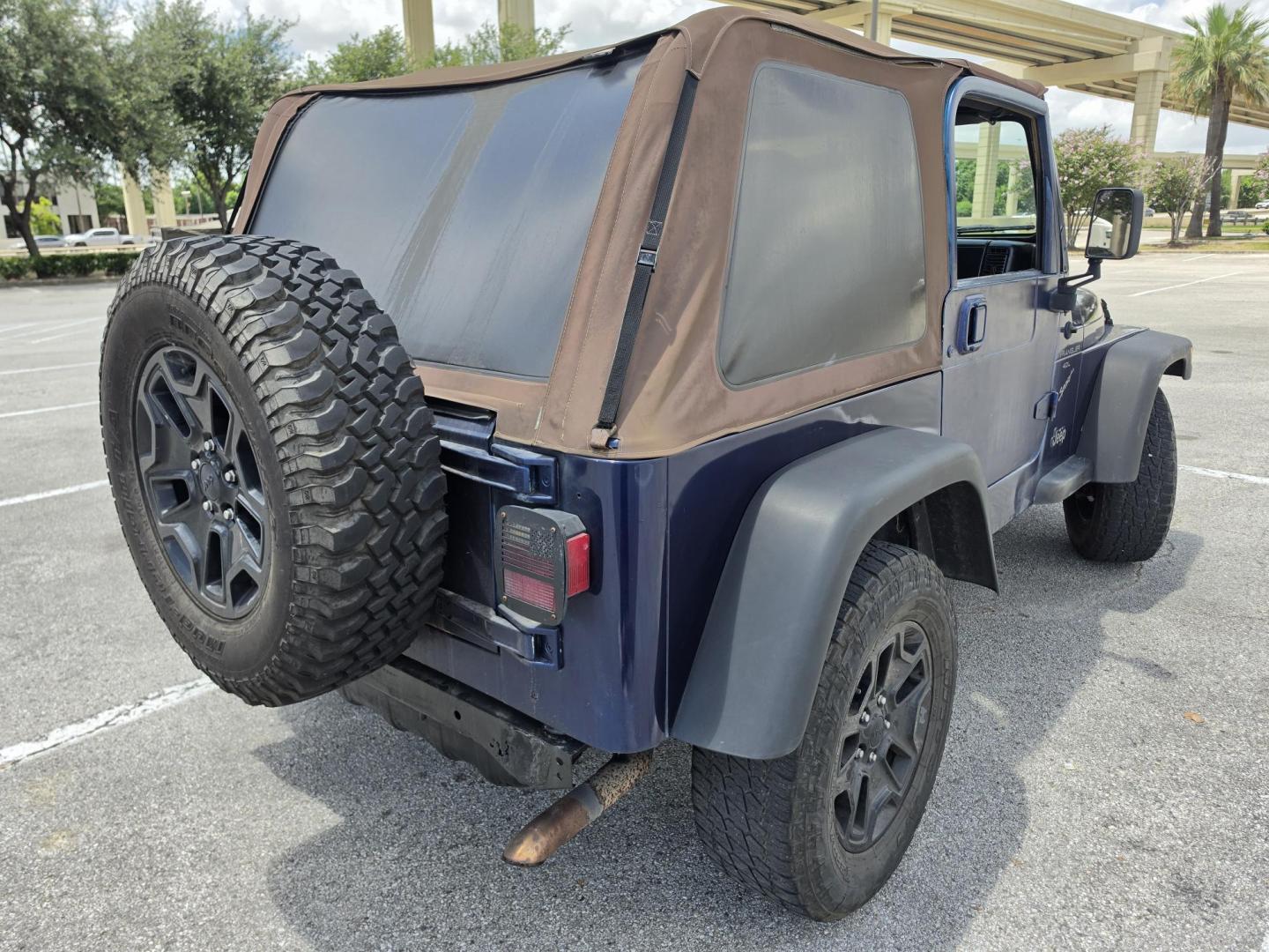 2001 Blue Jeep Wrangler Sport (1J4FA49S31P) with an 4.0L L6 OHV 12V engine, located at 5005 Telephone Rd., Houston, TX, 77087, (713) 641-0980, 29.690666, -95.298683- Photo#3