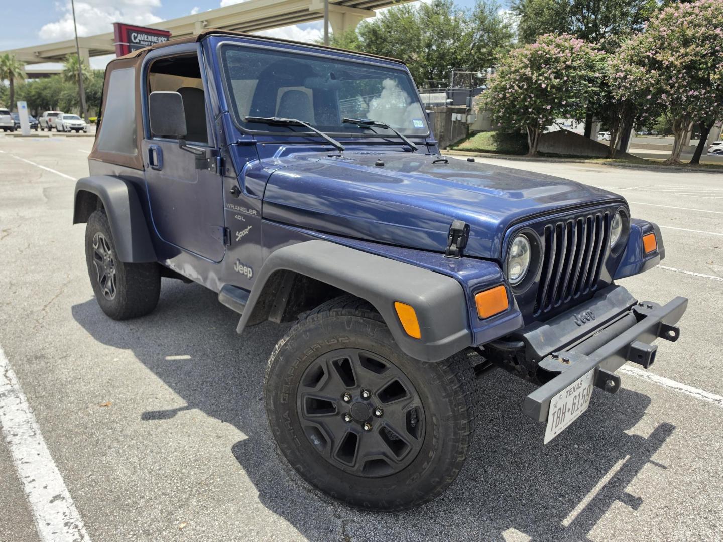 2001 Blue Jeep Wrangler Sport (1J4FA49S31P) with an 4.0L L6 OHV 12V engine, located at 5005 Telephone Rd., Houston, TX, 77087, (713) 641-0980, 29.690666, -95.298683- Photo#2