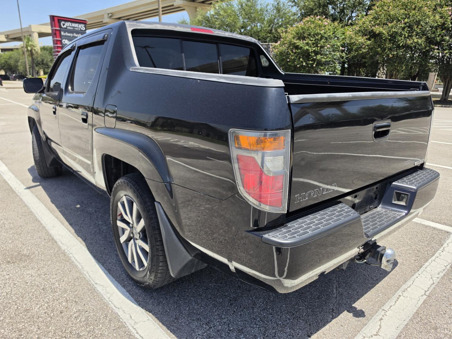 2006 Black Honda Ridgeline RTL (2HJYK16516H) with an 3.5L V6 SOHC 24V engine, 5A OD transmission, located at 5005 Telephone Rd., Houston, TX, 77087, (713) 641-0980, 29.690666, -95.298683- Photo#1