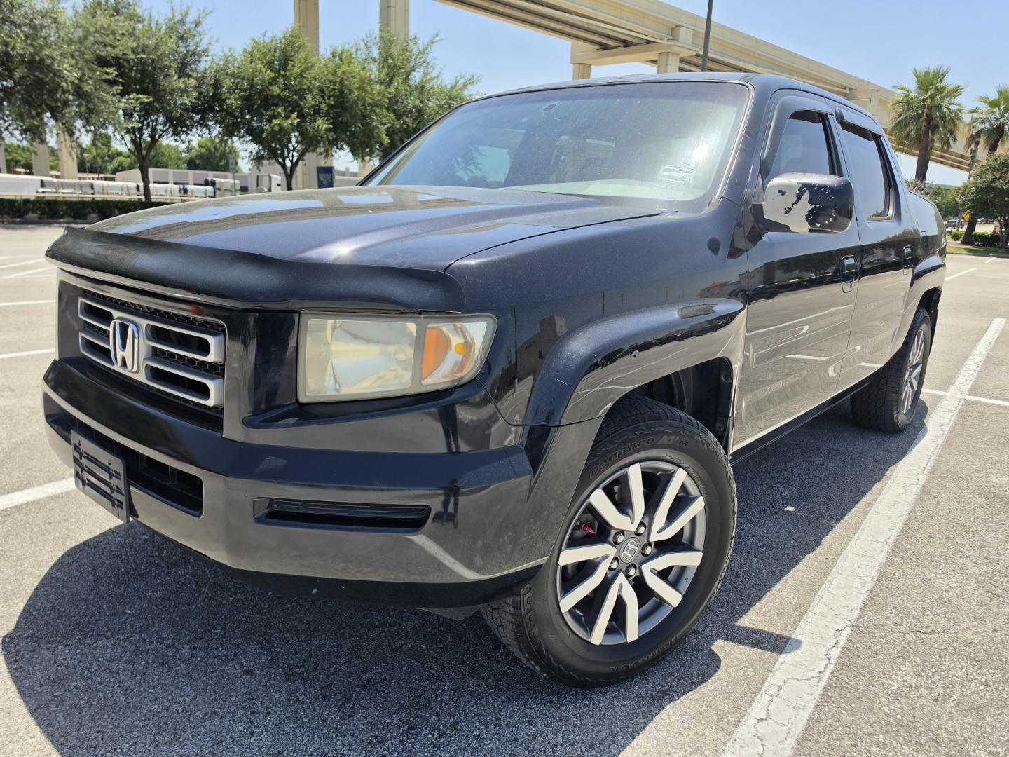 2006 Black Honda Ridgeline RTL (2HJYK16516H) with an 3.5L V6 SOHC 24V engine, 5A OD transmission, located at 5005 Telephone Rd., Houston, TX, 77087, (713) 641-0980, 29.690666, -95.298683- Photo#0