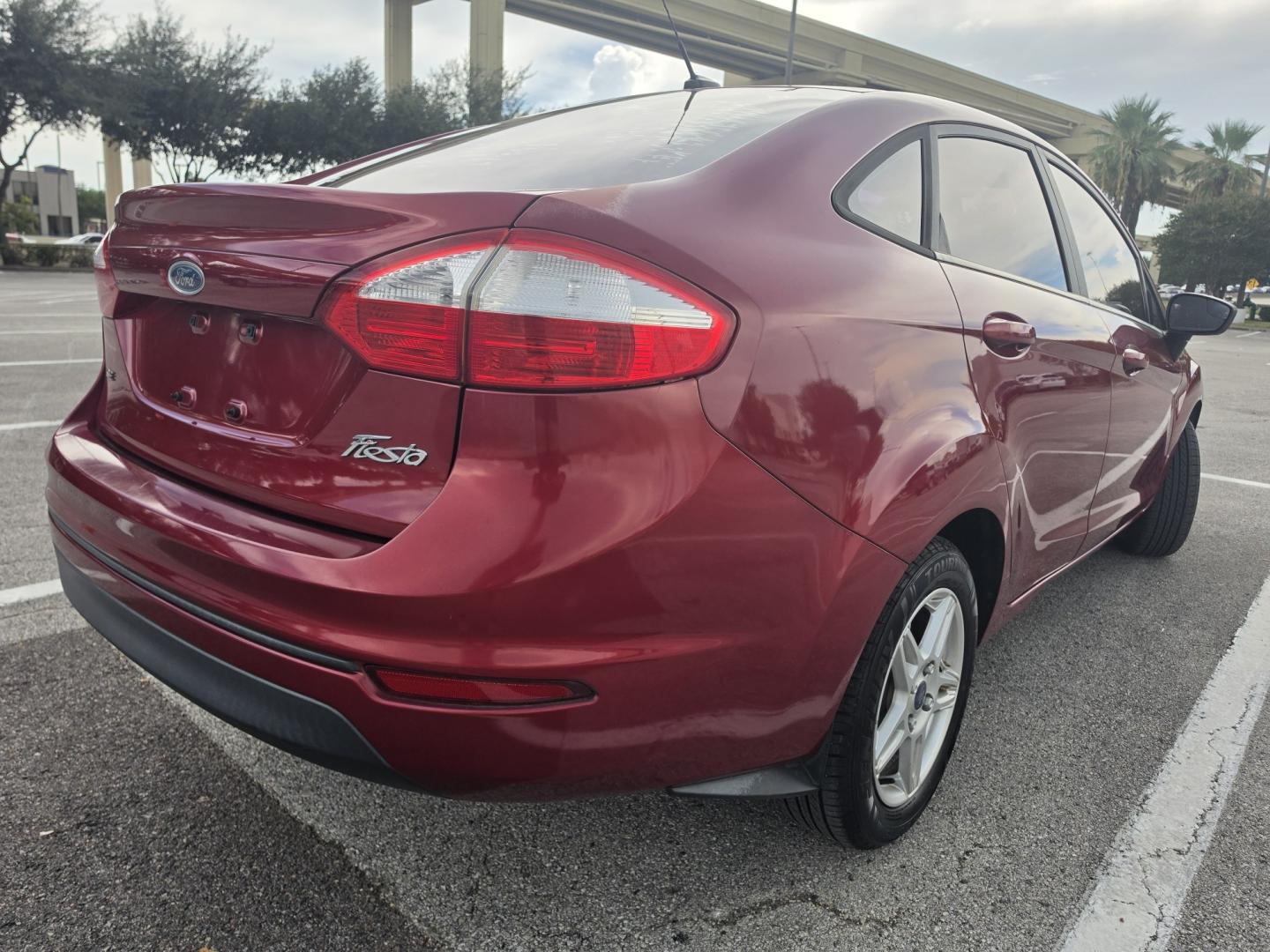 2017 Red Ford Fiesta SE Sedan (3FADP4BJ9HM) with an 1.6L L4 DOHC 16V engine, located at 5005 Telephone Rd., Houston, TX, 77087, (713) 641-0980, 29.690666, -95.298683- Photo#2