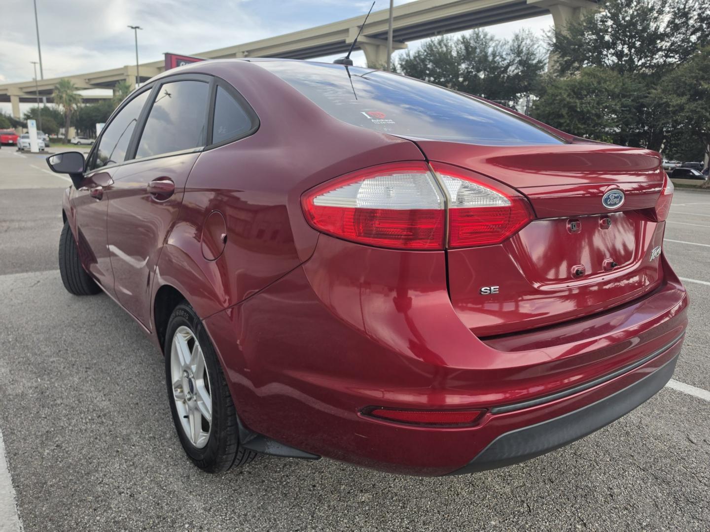 2017 Red Ford Fiesta SE Sedan (3FADP4BJ9HM) with an 1.6L L4 DOHC 16V engine, located at 5005 Telephone Rd., Houston, TX, 77087, (713) 641-0980, 29.690666, -95.298683- Photo#1